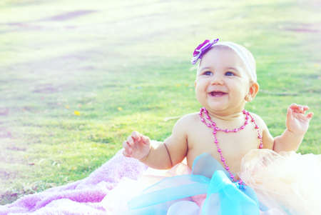 Baby girl at the gardenの写真素材