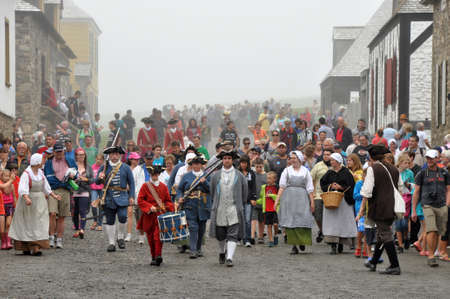 Cape Breton,  CANADA - July 30, 2013: Show with actors in historic costumes at Louisbourg Fortress at Louisbourg Fortress, National Historic Site, Nova Scotia, Canadaのeditorial素材