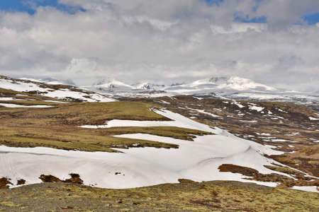 Dovrefjelll, Norway - June 4, 2015: View into the highlands of Dovrefjell National Park and the summit of Snøhetta, Norway in spring.のeditorial素材