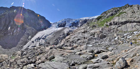 Buarbreen, Norway - August 11, 2011: Panorama of the Buarbreen glacier with hikers on a summerday.のeditorial素材