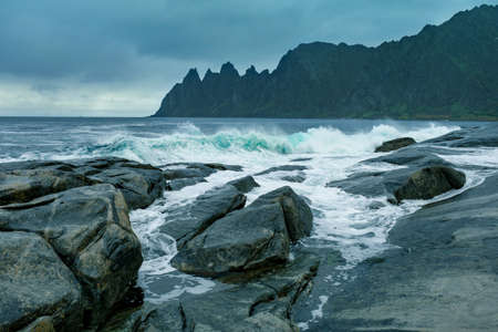 Okneset and Ersfjord from Tungeneset on a stormy day with breaking waves and sprayの写真素材