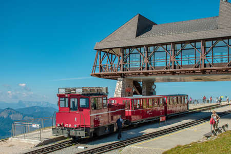 Cog railway train of the Schafbergbahn at the mountain station in Salzkammergut in Austria.のeditorial素材
