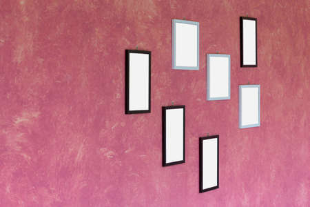 Blank picture frame on wallの写真素材