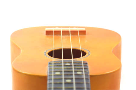 Part of Vintage ukulele isolated on white background