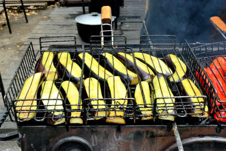 grilled eggplant on the grill over the coals. outdoor kitchen. Ukraine, summer, ethnographic festivalの写真素材