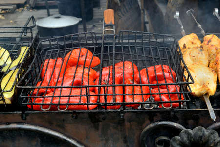 sweet red pepper cooked on the grill. outdoor kitchen. ethnographic festival. Ukraine.の写真素材