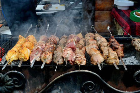 skewers of pork and chicken. cooking on the grill over hot coals. ethnographic festival, Ukraineの写真素材