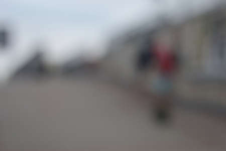 strongly blurred background with silhouettes of people