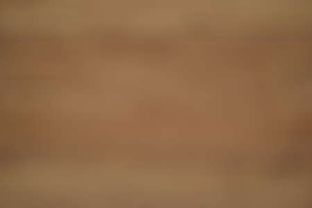 abstraction, background blur, light, wooden, brown tones. obtained by blurring the optics of the camera without the use of program editorsの写真素材