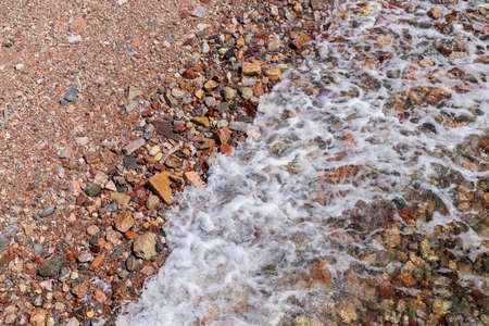 red sea, pebbles and shellsの写真素材