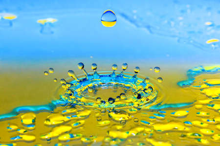 Beautiful splash of water drop. Freeze action. High-speed shooting of water drop. Beautiful drops of stop time, water splashing close up. Crystal clear water waves, drops and sprays. Crownの写真素材