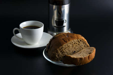 fresh black coffee with chocolate chip sliced bread on the background.の写真素材