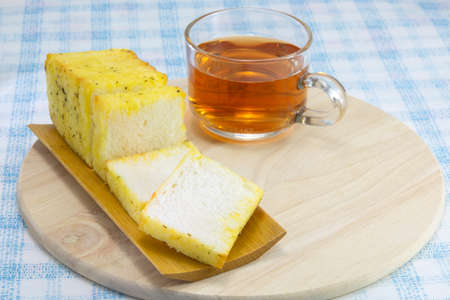 garlic bread cheese with tea on wood