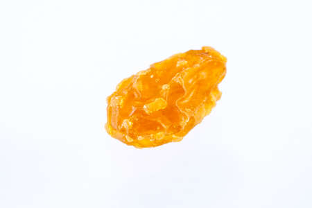 Yellow sultanas raisins isolated on white backgroundの写真素材