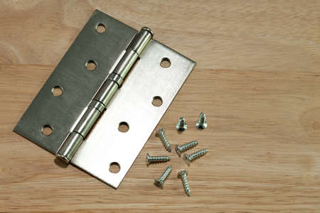 hinges and screw on woodenの写真素材