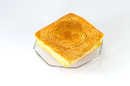 Toasted bread with melted cheddar cheese isolatedの写真素材