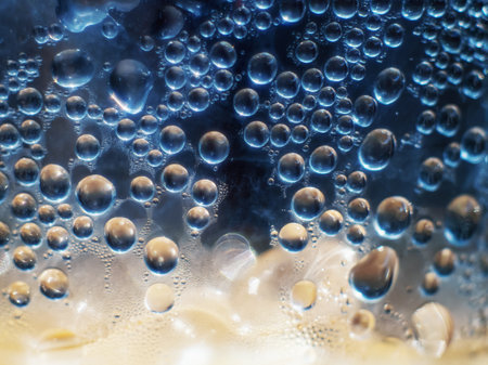Water drops of rain on blue glass backgroundの写真素材