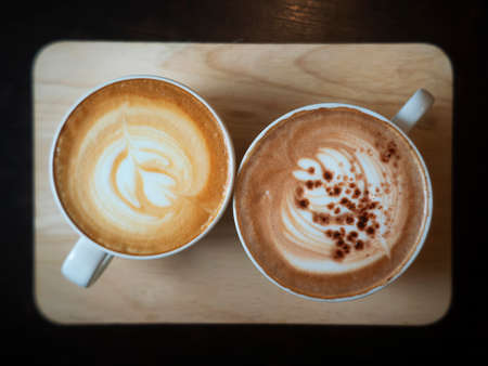latte coffee cup and Mocha coffee cup on wood tray