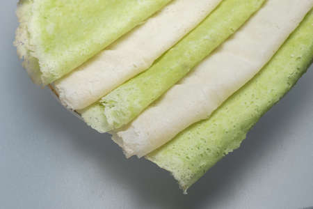 Roti sai mai is name of thai cotton candy wrapped with pastry dough cut into thin slices serving