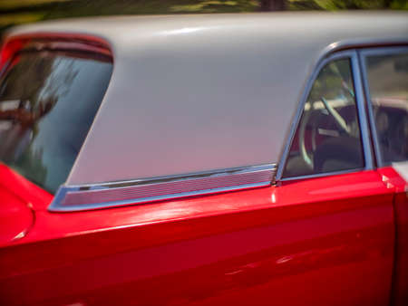 Side view of a classic  car from the fifties. the car is in excellent condition given the glossy paint and chrome.の写真素材