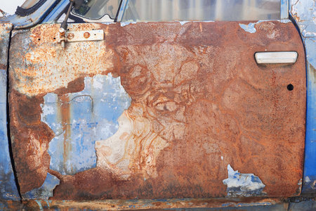 Ancient car abandoned in the countryside and illuminated with lanternsの写真素材