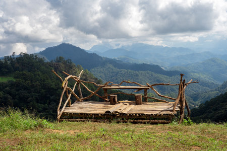 Wooden bench for view watching on mountain, hadubi camping Thailand.の写真素材