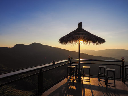 Young asia woman tourist in tropical rainforest and enjoying scenery during sunset beautiful in high mountainsの写真素材