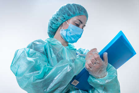 Coronavirus. Thank you doctors and nurses working in the hospitals and fighting the coronavirus. Doctors are heroes. Doctors in the protective suits and masks looking for a cure for the disease.の写真素材