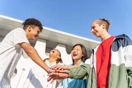 College student teamwork stacking diverse hand togetherness concept.