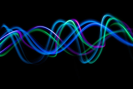 Abstract technology banner design. Long exposure, light painting. Vibrant streaks of digital neon...