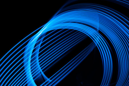 Abstract neon lights glow and flash effect. Background with flying design elements.の写真素材