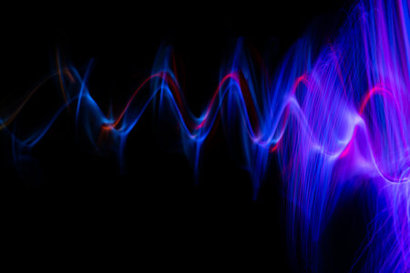 Futuristic light wave of energy with elegant glowing lines. Abstract technology background.