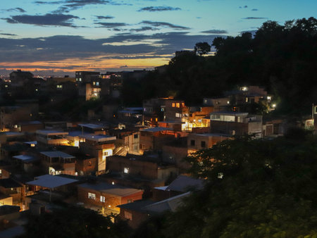 Aerial view of a small town in the middle of the mountains at sunsetの写真素材