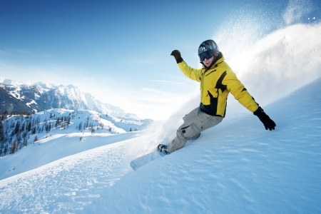 Young snowboarder in deep powder - extreme freeride Young snowboarder in deep powder - extreme freeride