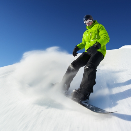 Snowboarder on pise in high mountainsの写真素材