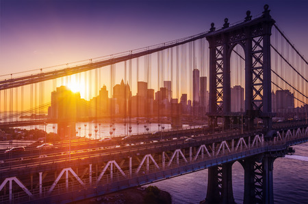 New York City - beautiful sunset over manhattan with manhattan and brooklyn bridgeの写真素材
