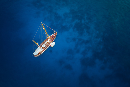 amazing view to yacht and clear water at sunrise - caribbean paradiseの写真素材
