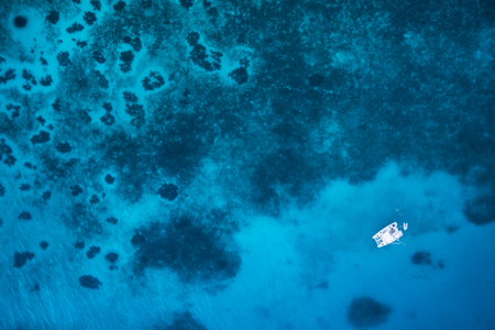 Motor boat in amazing colorful water of Seychelles Coco Island natureの写真素材