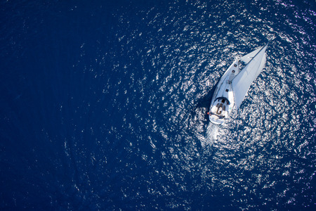 Yacht sailing at free ocean / see at sunny dayの写真素材