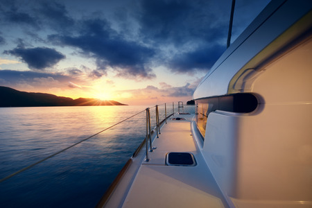 Beautiful view to catamaran in Seychelles bay at sunsetの写真素材