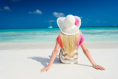 Girl on the beach at sunny dayの写真素材