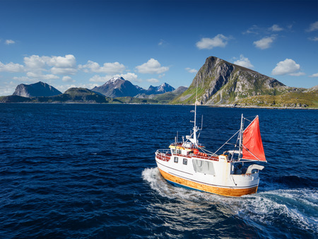 Fishing boat in Norway fjord - sea in lofoten amazing nature.の写真素材