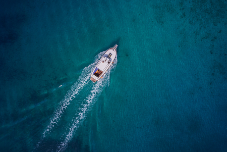 Vintage wooden boat in coral sea. Boat drone photo.の写真素材