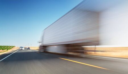 Blurred truck on road. Truckig - transportation theme - background.の写真素材