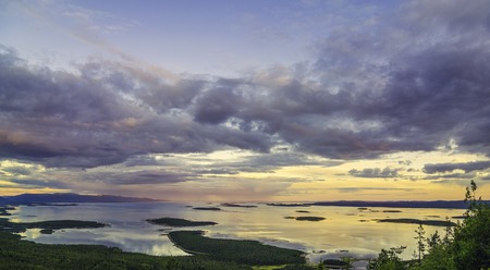Aerial view of Colorful sunset landscape on the coast of the North Sea. Karelian pine on the rocks on the shore of the White Sea. Coast Murmansk region, Kandalaksha Nature Reserveの写真素材
