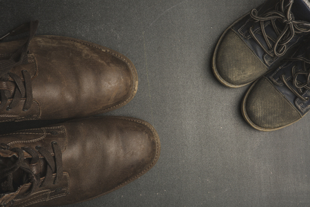fathers day concept. Big and small shoesの写真素材