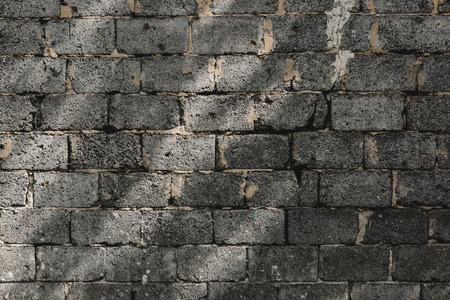 gray large brick wall wth shadows texture