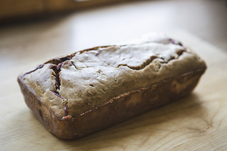 Loafes of fresh baked bread with black currant berries