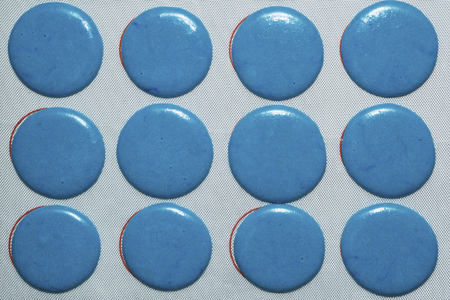 Blue and white Raw macarons before ovenの写真素材
