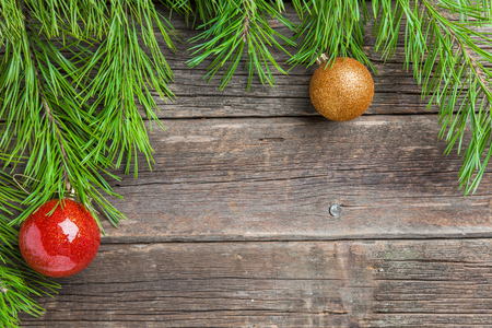 Vintage Cristmas decoration with fir branch over old wooden background. Flat lay, text spaceの写真素材